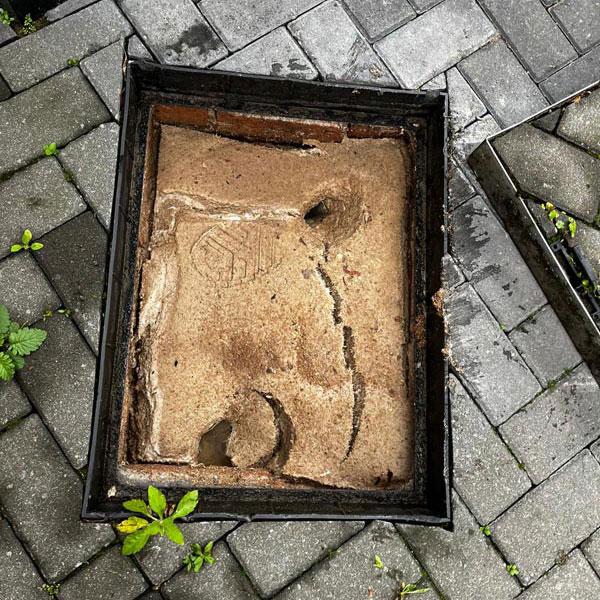 A photo of a drain that was blocked due to poor maintenance.