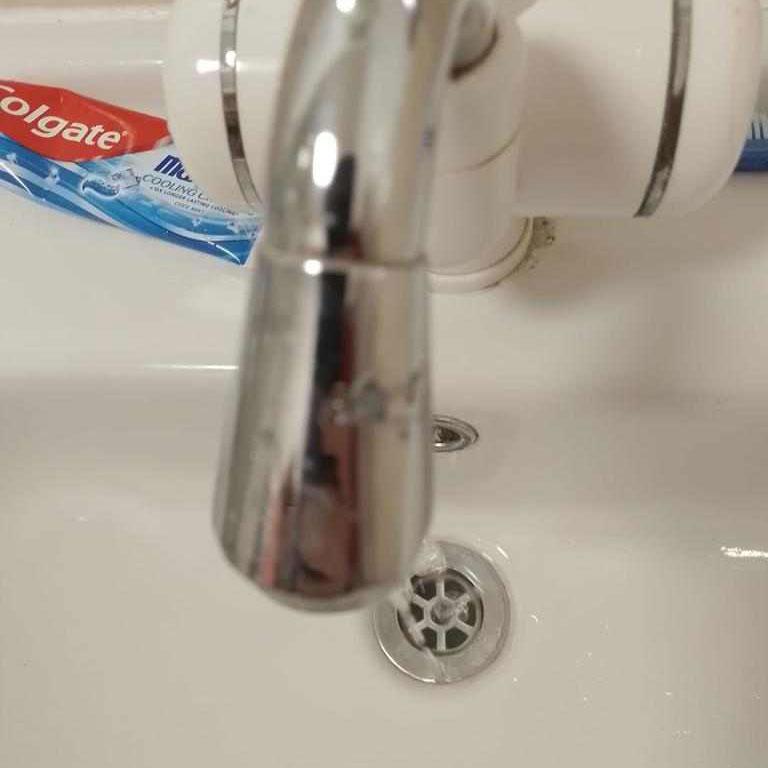 A photo of a sink that has been unblocked in an emergency situation.